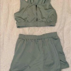 Matching teal shorts and a crop top